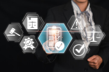 Businessman in a suit interacting with virtual icons representing compliance, legal regulations,...
