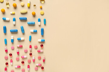Different pills on beige background