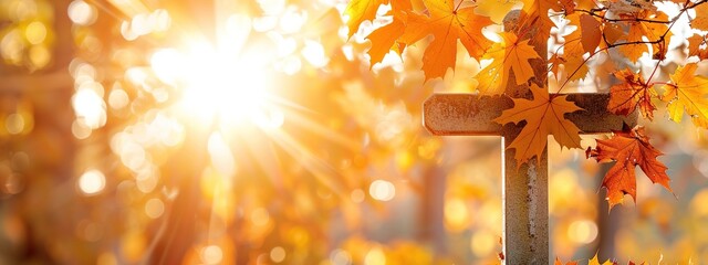 Sun shining through a cross on a background of golden autumn leaves in fall, symbolizing faith and hope. powerful message of belief and optimism.Cross, Faith, Hope, Conviction