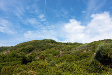Natural landscape of the hill with the lighthouse in Othonoi island, Greece