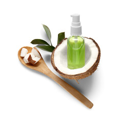 Bottle of coconut cosmetic oil and leaves on white background