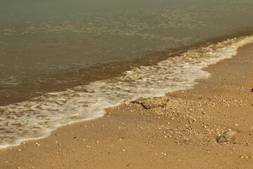 Redang beckons with its beautiful beach landscape, adorned with ornamental charm under the vast blue sky on a bright holiday day pictured with long shutter exposure.