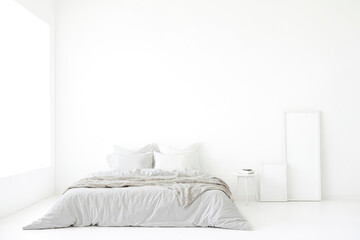 Minimalist Bedroom Interior with White Walls and Bed