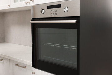 New electric oven in kitchen. Cooking appliance