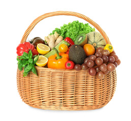 Many different fruits and vegetables in wicker basket isolated on white