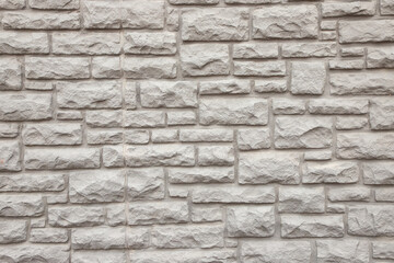 Beige stone wall full frame background.