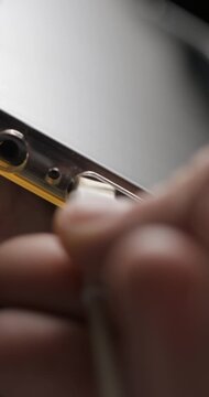 USB-C cable macro plugin to smartphone slow motion, vertical view