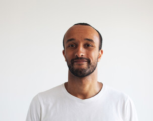 Photo of afro man wear white t-shirt isolated on grey background