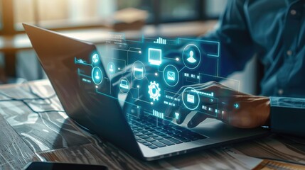 Person using a laptop with a futuristic digital interface hologram overlay in a modern office setting.