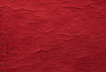 A smooth, abstract background featuring a gradient of deep red hues with subtle textures. A close-up view, create a dynamic pattern. The rich red color adds depth and warmth to the image.