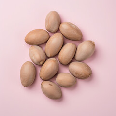 Obraz premium Oval Ginkgo Nuts with Soft Pink Background