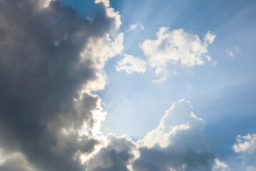 Sunlight shining through dark clouds