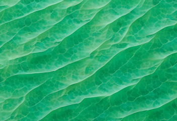 An abstract pattern of green waves resembling water surface, with a textured appearance a vibrant green color with a marbled effect, resembling jade. The light creates movement in the design.