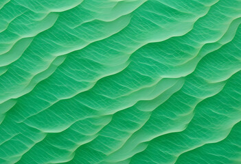 Obraz premium An abstract pattern of green waves resembling water surface, with a textured appearance a vibrant green color with a marbled effect, resembling jade. The light creates movement in the design.