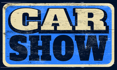 Aged and worn car show sign on wood