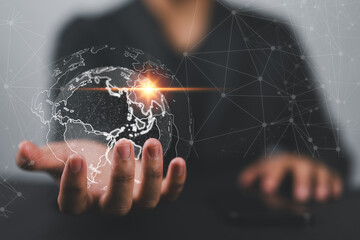 Global Business Intelligence, businessman uses a digital interface to analyze data, unlocking insights for strategic decision-making. world map composition signifies international reach of business.