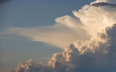 The sky is filled with clouds, and the sun is shining through them