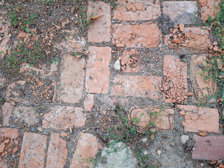 An old road covered with red bricks
