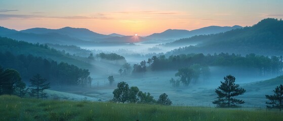 Obraz premium Tranquil Sunrise over Misty Valley with Layers of Mountains and Trees