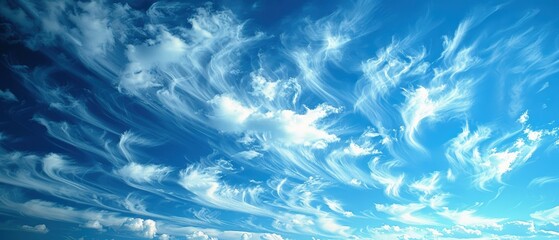 Obraz premium Serene View of Wispy Cirrus Clouds in a Bright Blue Sky