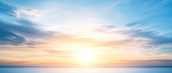 Fototapeta premium Beautiful sunrise over a calm ocean with a colorful sky filled with clouds.