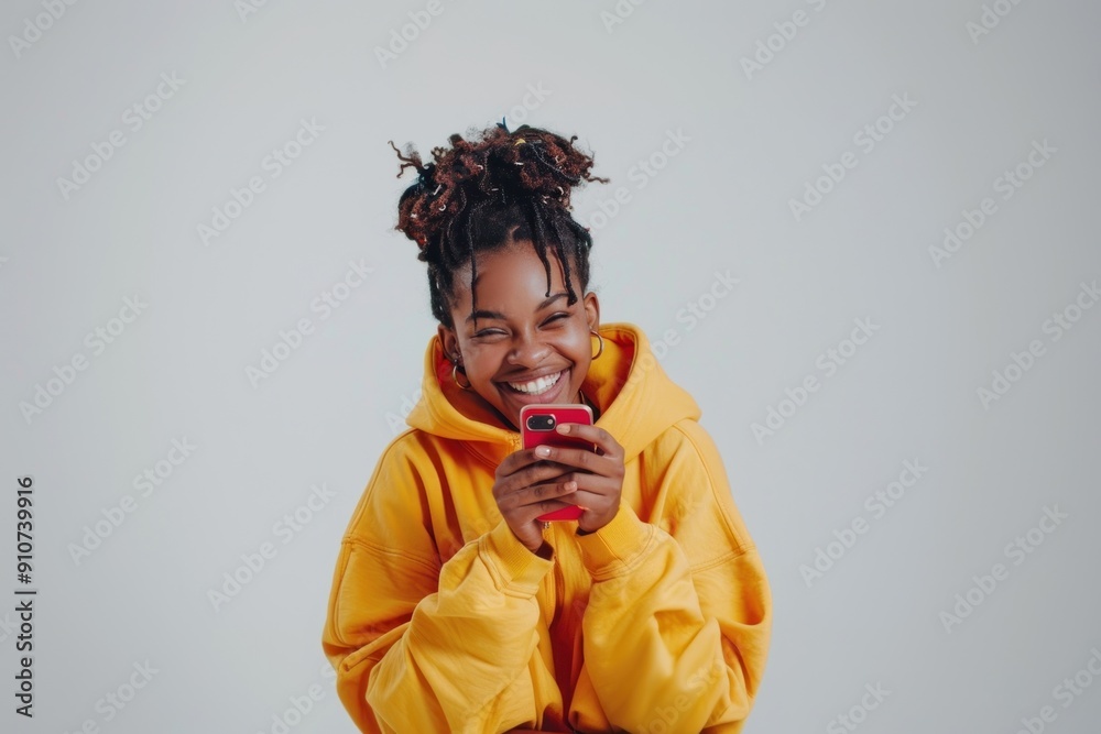 Wall mural Happy woman holding red phone