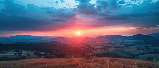Fototapeta premium Majestic Sunset Scenery of Rolling Hills with Dramatic Cloud Layers and Golden Glow