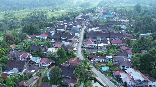 Sungayang, Tanah Datar, West Sumatra, Indonesia - August 6, 2024: Aerial drone view of Nagari Baruh Bukit, highlighting the scenic village, lush greenery, and traditional Minangkabau architecture.