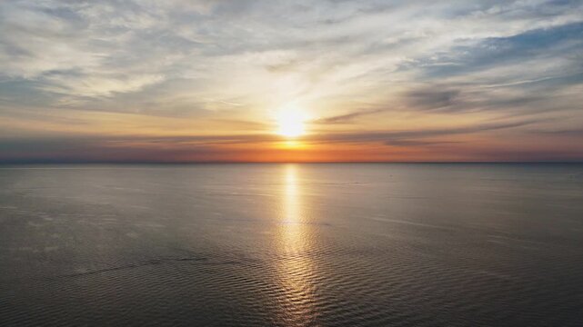 Drone shot pulling out over a Lake Erie sunset.