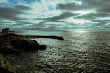 2024-06-28 A MUTED SUNSET WITH STREAKY CLOUDS ALOG THE LA JOLLA COASTLINE BY THE CHILDRENS POOL NEAR SAN DIEGO CALIFORNIA