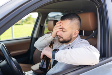 man drinking alcohol while driving the car. Don't drink and drive concept. . High quality photo