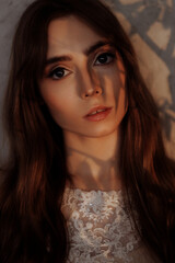 Fototapeta premium Portrait of a young beautiful woman with blue eyes.