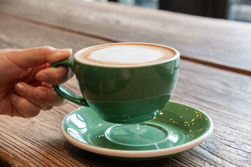 cup of coffee on wooden table
