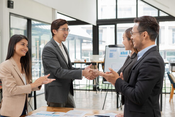 Asian Business Group Chat about graph work Present in meetings, in the office