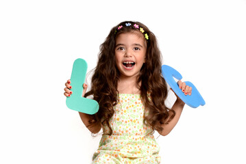 A 4-year-old little girl is practicing correct pronunciation. Speech therapist, speech disorder