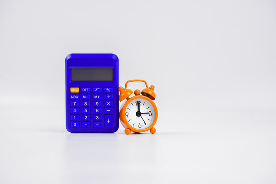 A calculator and clock. Isolated with white background.