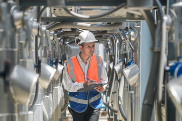 Engineers inspect gas and water pipes for power and cooling in industrial and building systems....