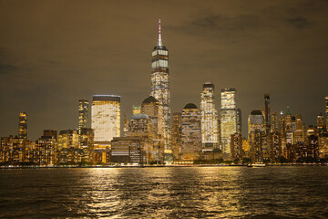 Obraz premium Night in The NYC city, USA, United States. Night day with iconic buildings. New York City NYC Manhattan Downtown Skyline, viewed from Jersey City, USA.