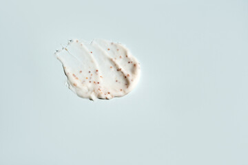 A smear of scrub on a light background. Beauty concept.