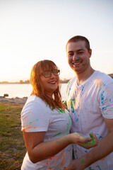 Obraz premium Couple smiling with paint splatters on their clothes