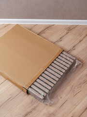 the girl takes out the construction panels for wall cladding fro