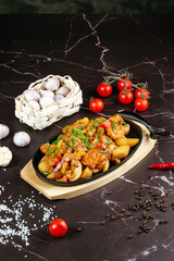 Asian frying pan with meat and vegetables in sauce