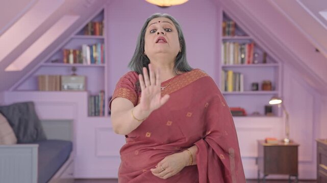 Angry Indian old woman saying No to someone