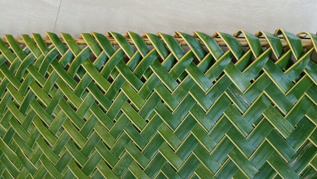  zig zag interlace green coconut palm leaf , green foliage interlace texture close up
