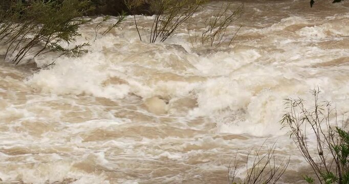 Close up flash flood flows after a heavy rainstorm. Power waterfall, Water from the mountain.
