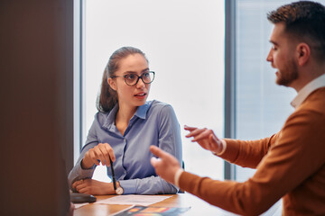 Businesswoman Leading Discussion in Modern Office Setting