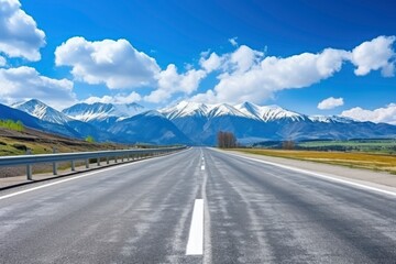 Fototapeta premium Straight asphalt highway road and snow mountains with sky clouds natural landscape. car background with generative ai
