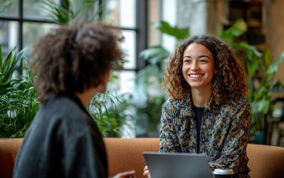 A professional mentoring session between a manager and a junior employee in a cozy office corner., 