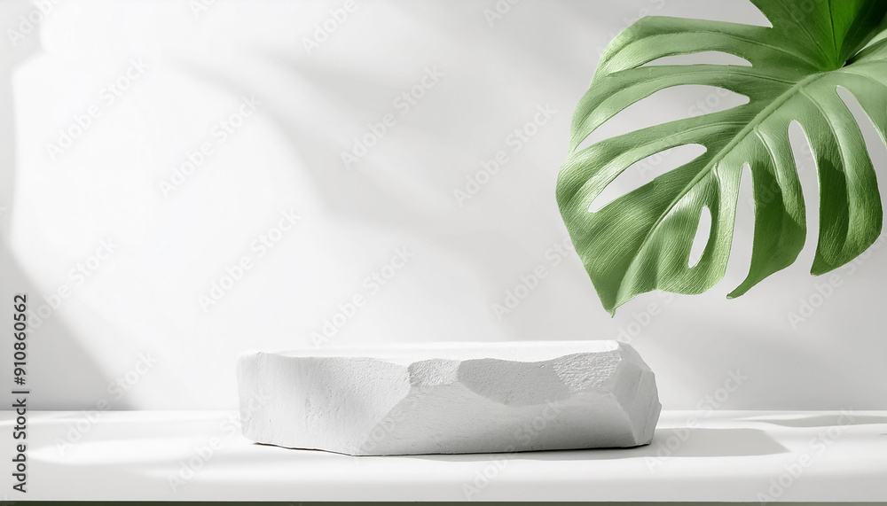 Wall mural white stone product display podium with monstera leaf on white background