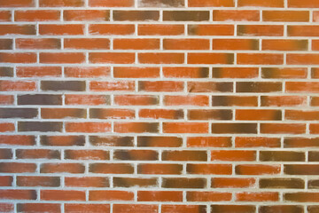 Texture of the wall is made of red weathered brick, with cement seams and an aged rough appearance. Suitable for architectural, urban or vintage design projects.